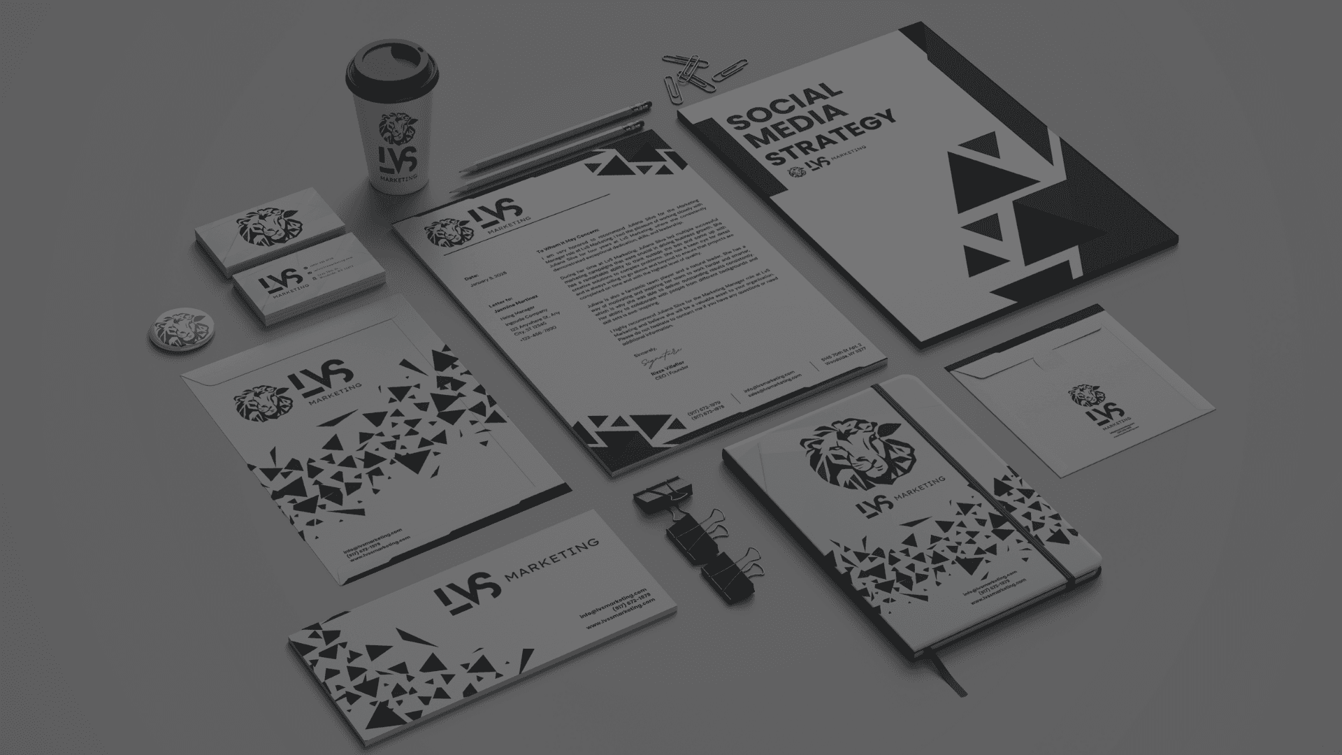 Branded stationery mockups on a desk